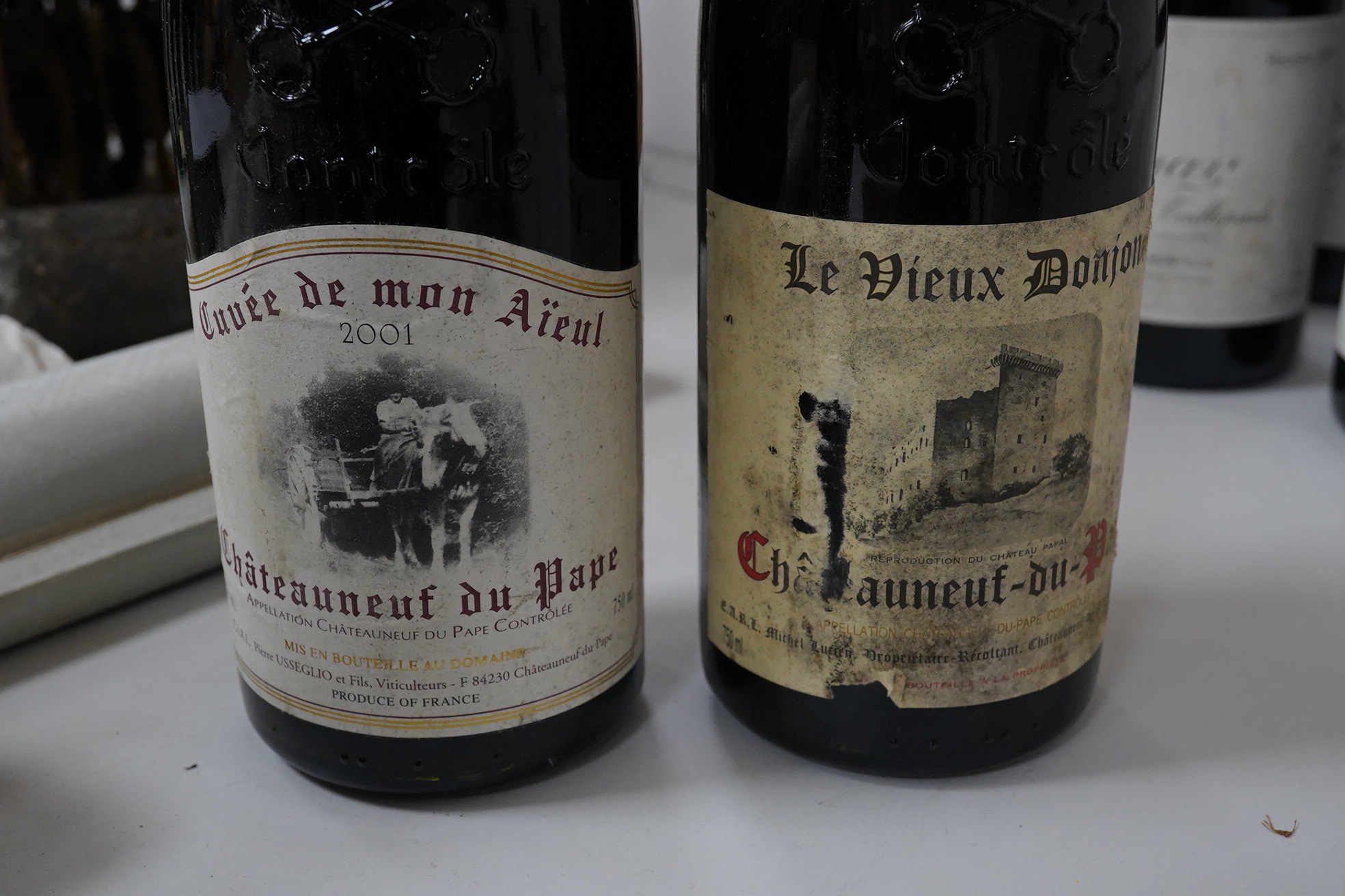 Two bottles of Chateauneuf du Pape, Le Vieux Donion, (no year) and two bottles of Chateauneuf du Pape, 2001, Cuvee demon Aieul. Condition - fair/good